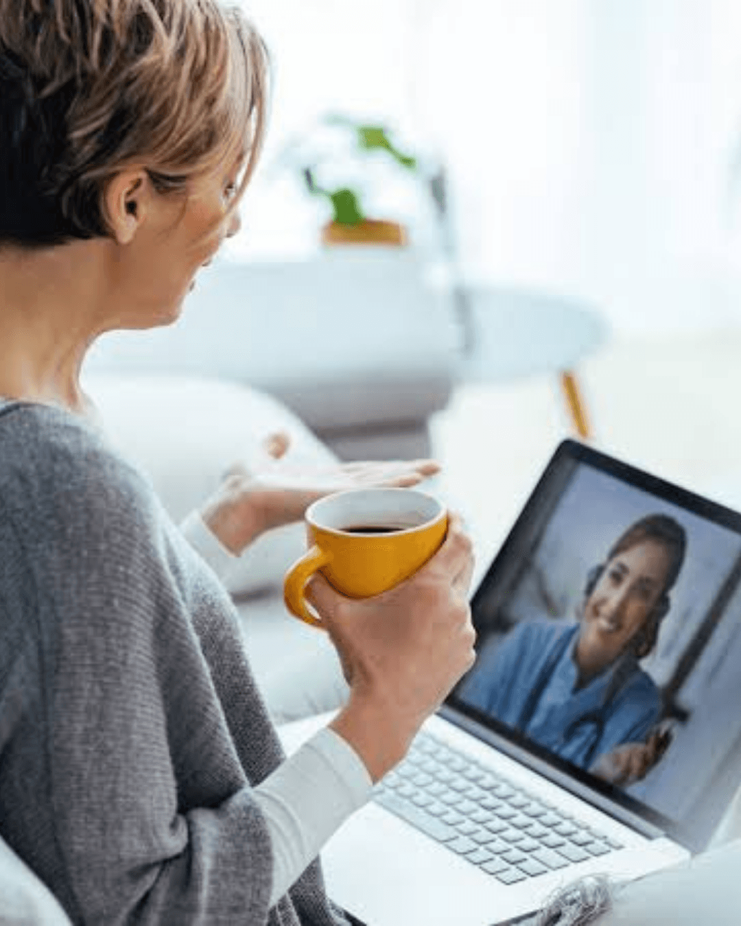 Woman joining a telehealth appointment from home